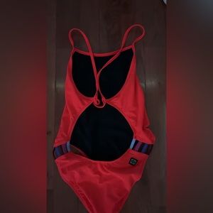 This is a hot pink Jolyn swimsuit, size 38.